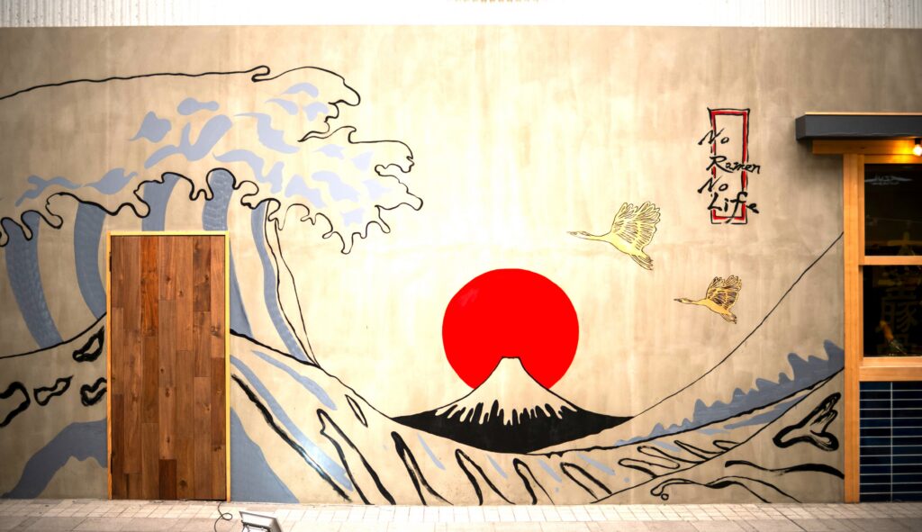 Japanese mural of Mount Fuji and the rising sun, symbolizing resilience, culture, and hope amid crisis